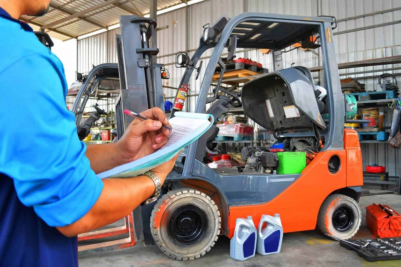 Mobile forklift technician inspecting a Toyota lift truck